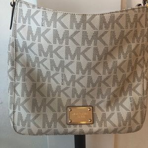 Michael Kors crossbody bag with MK logo.